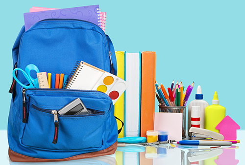 A backpack with a variety of school supplies