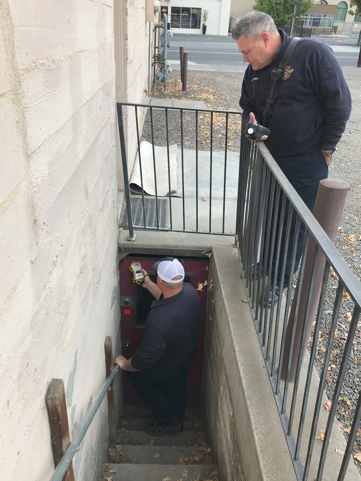 A team from Walla Walla Fire Department performs an air-quality reading at the basement of the Pantorium building on the corner of 2nd Avenue and Rose Street