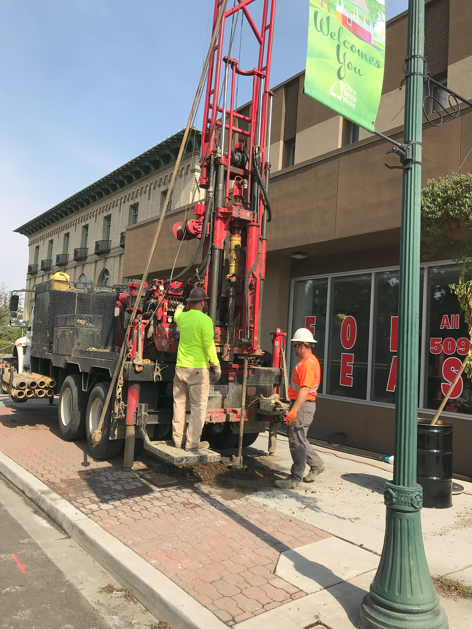 A crew from GeoEngineers drills through the sidewalk in front of 106 N. 2nd Ave., on Sept. 23, 2023.