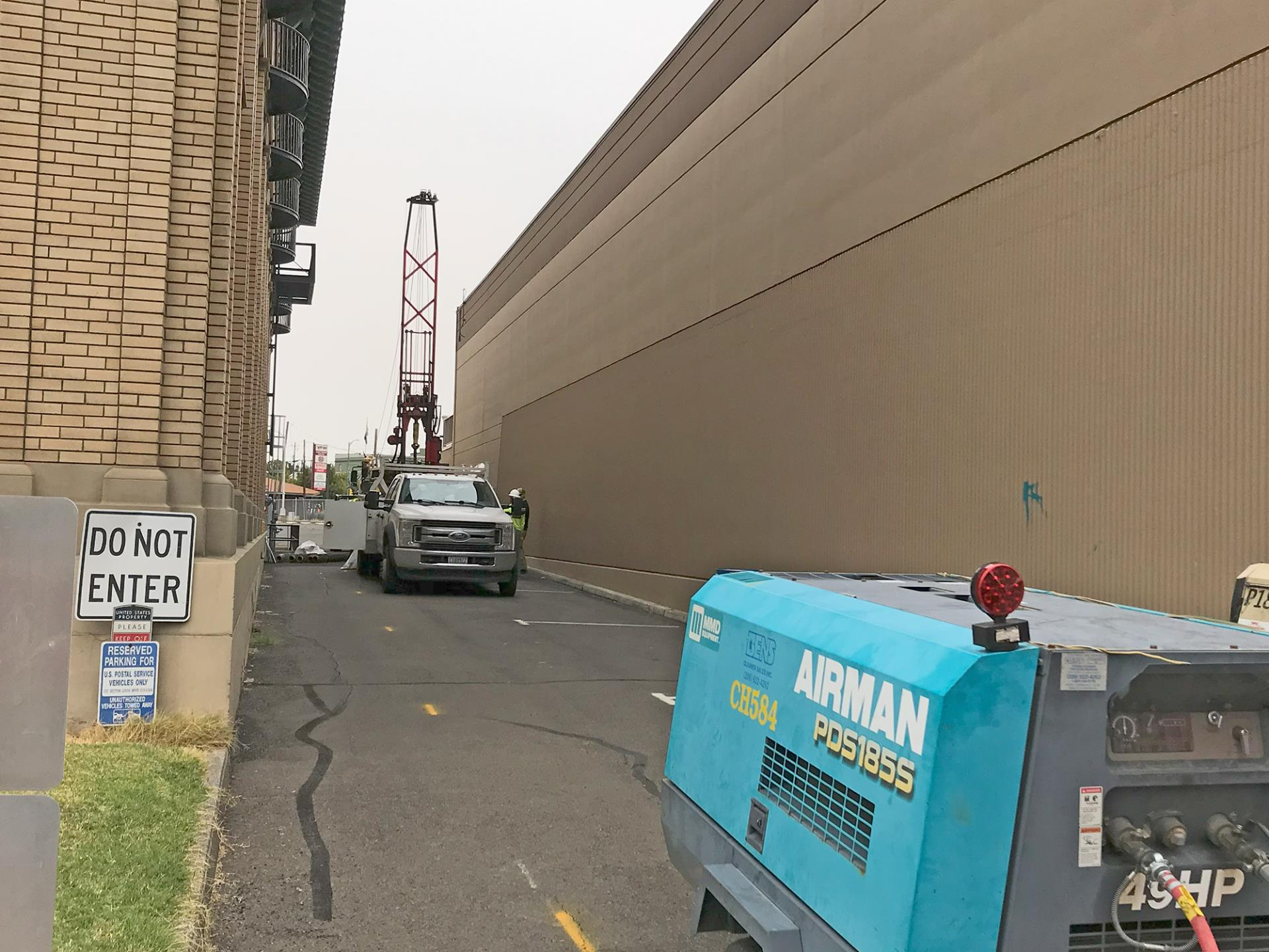 A crew drills a monitoring well in the alley between the Walla Walla Post Office and 106 N. 2nd Ave., on Sept. 24, 2023.