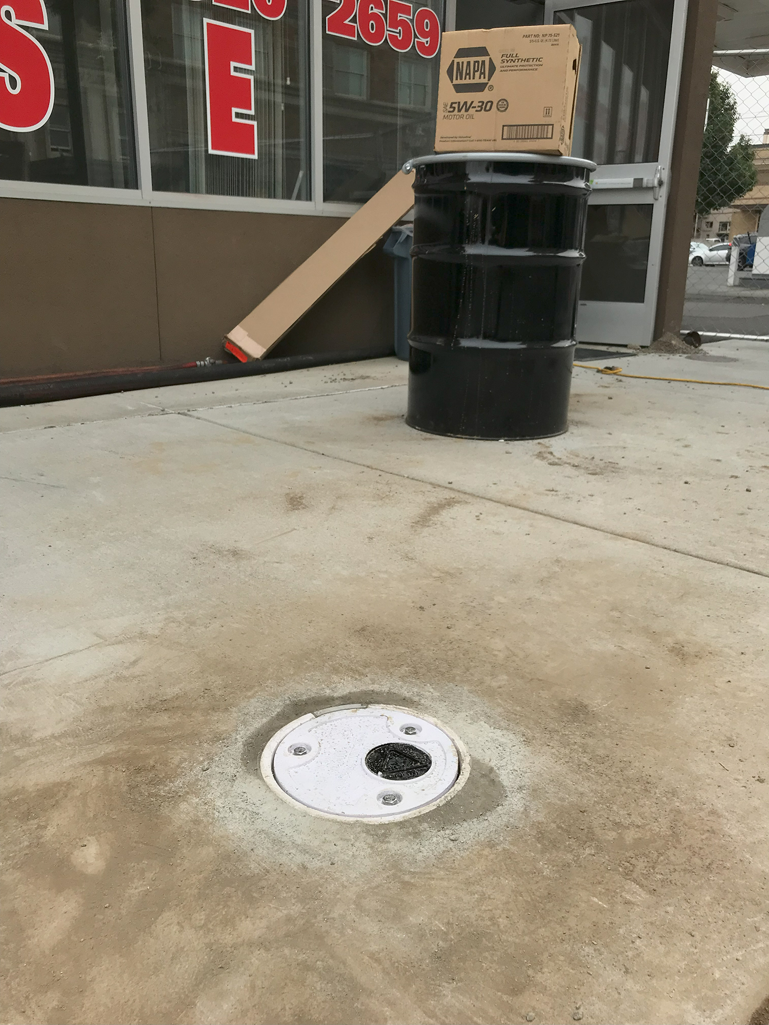 A cover is installed on each monitoring well to provide secure access for investigators to collect samples and perform readings.