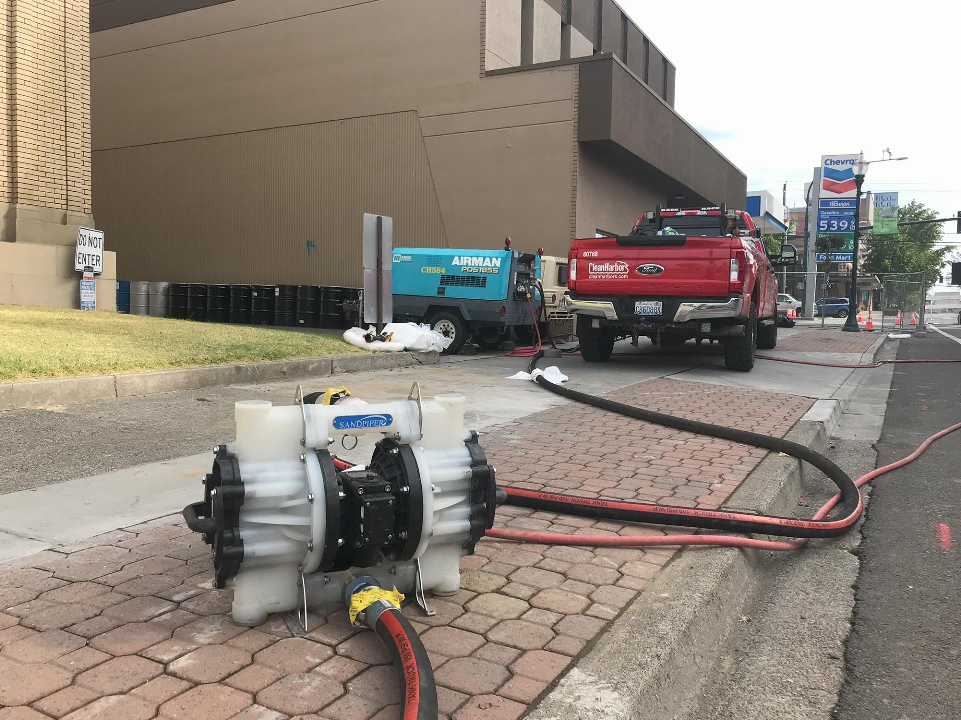 This pump moves contaminants pulled from the basement sump at 106 N. 2nd Ave. through a system of hoses to another pump, which moves them into a frac tank, on Sept. 25, 2023.