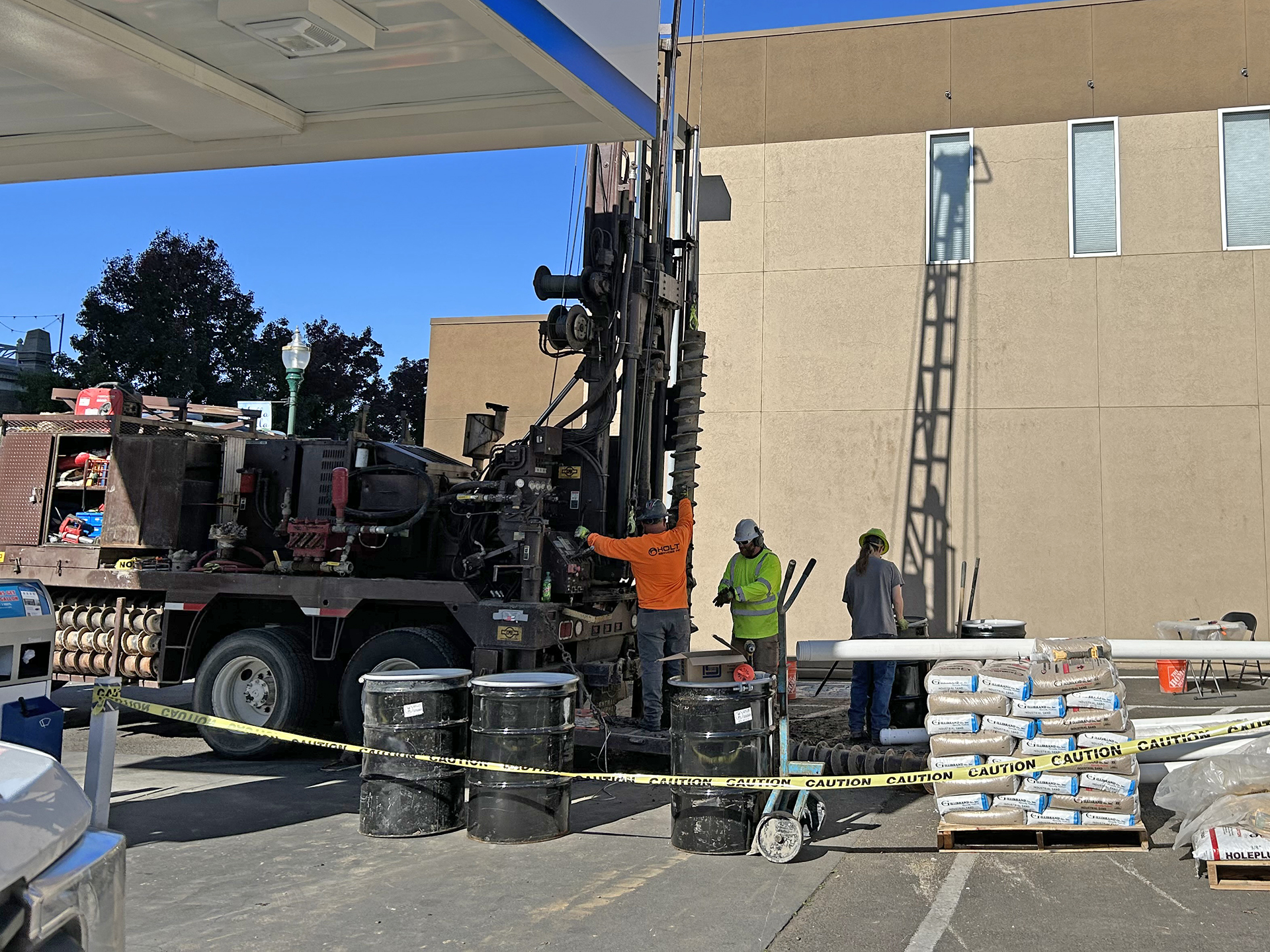 A Western States crew drills a monitoring well on the property of the Chevron station at 2nd and Rose, on Oct. 19, 2023.