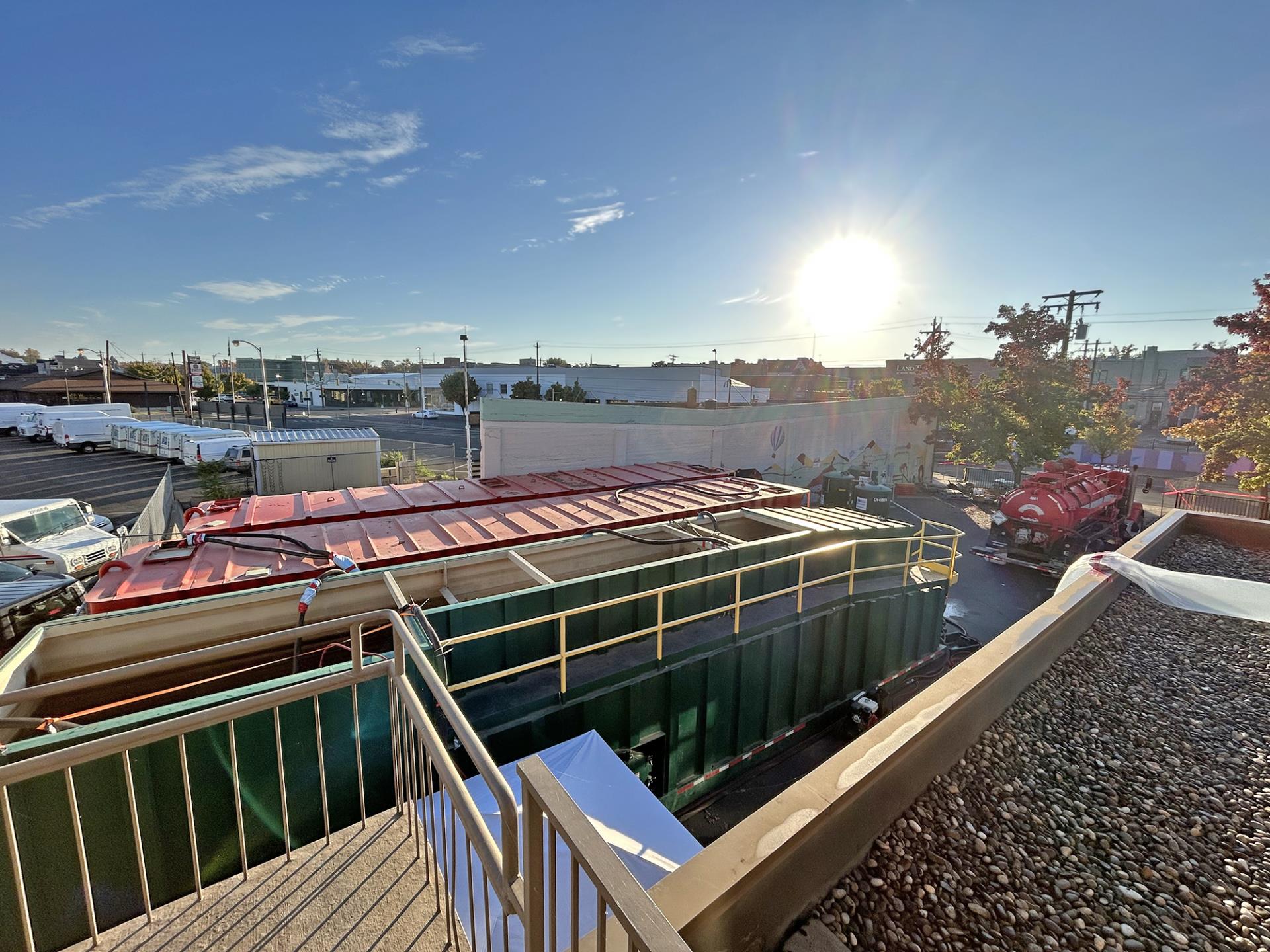 The water treatment system relocated to the 106 building's rear parking lot, as viewed from the roof of the building.